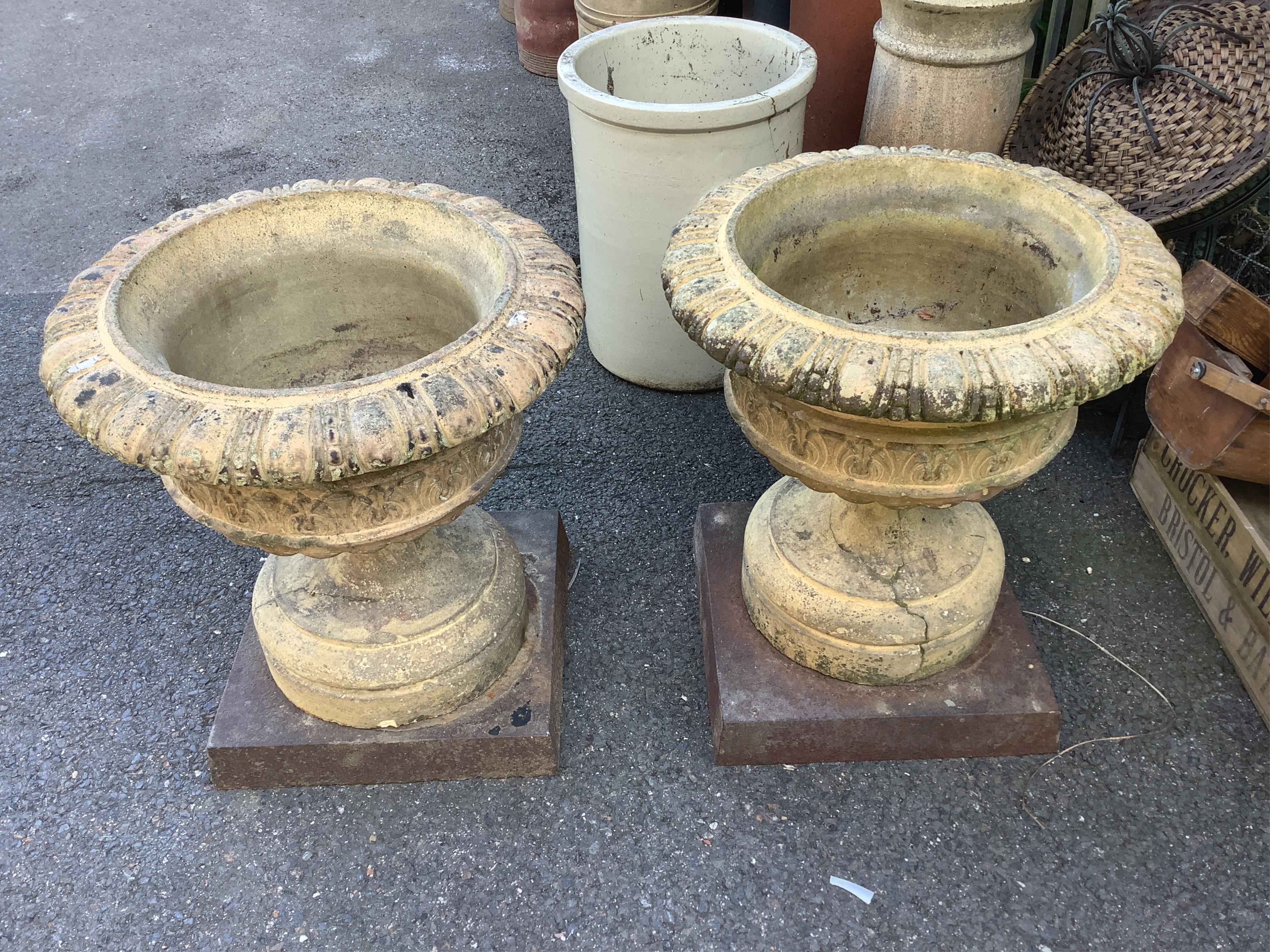 A pair of Coadestone pedestal planters, diameter 53cm, height 58cm. Condition - fair